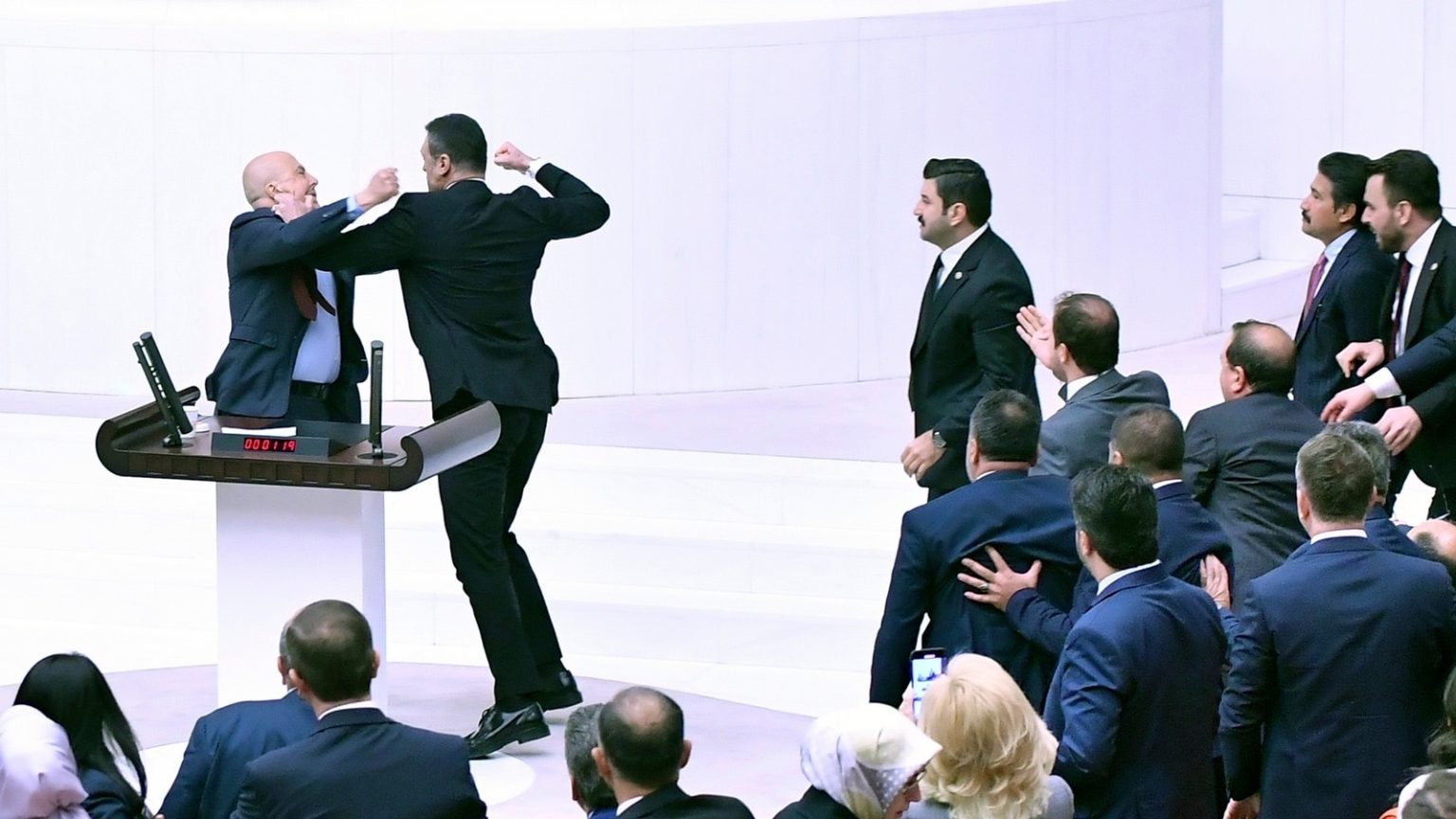 Turkey lawmakers draw blood in fist fight during debate on jailed MP.