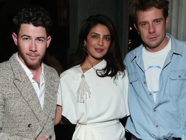 Priyanka Chopra with Nick Jonas makes heads turn in a chic white Dior dress at star-studded pre-Oscars dinner.